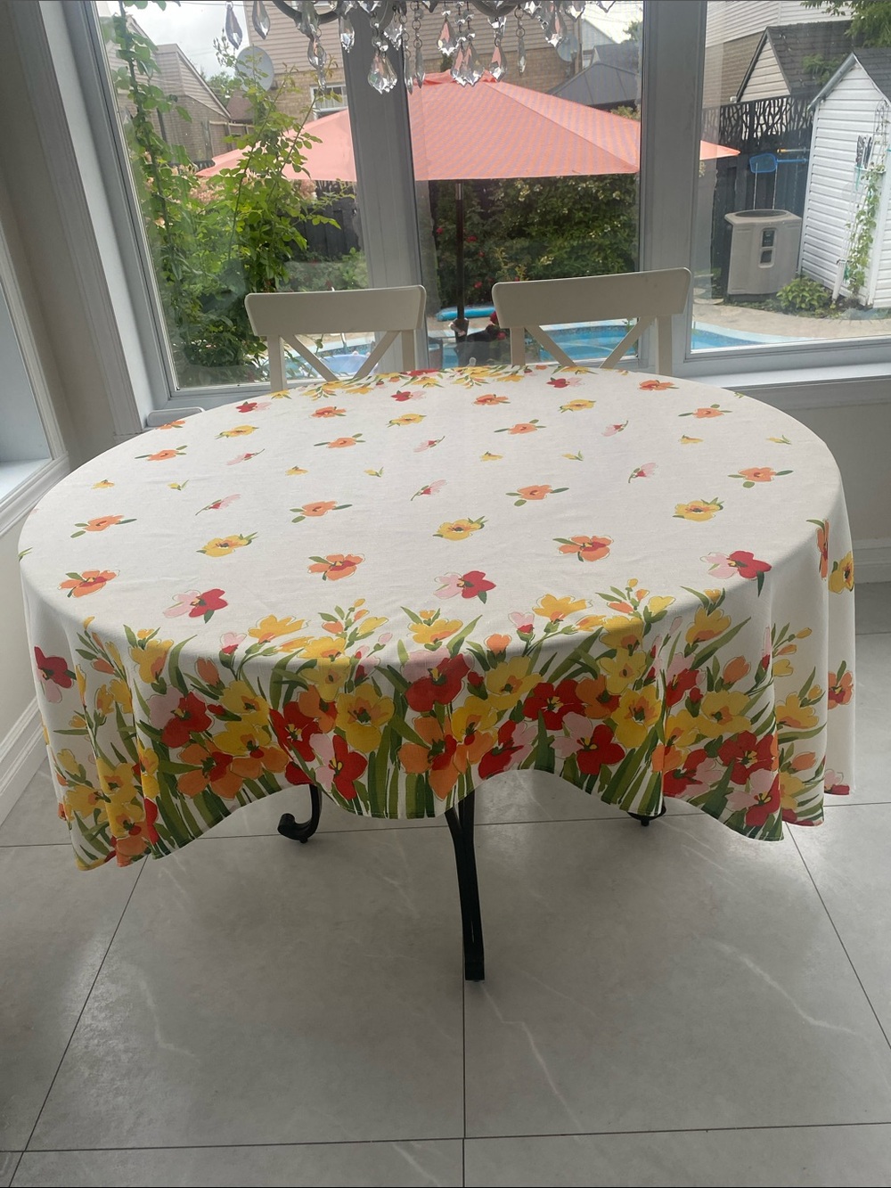 Cheery Oval Polyester Tablecloth in White/Yellow & Orange Blossoms 88.5”x 58”
